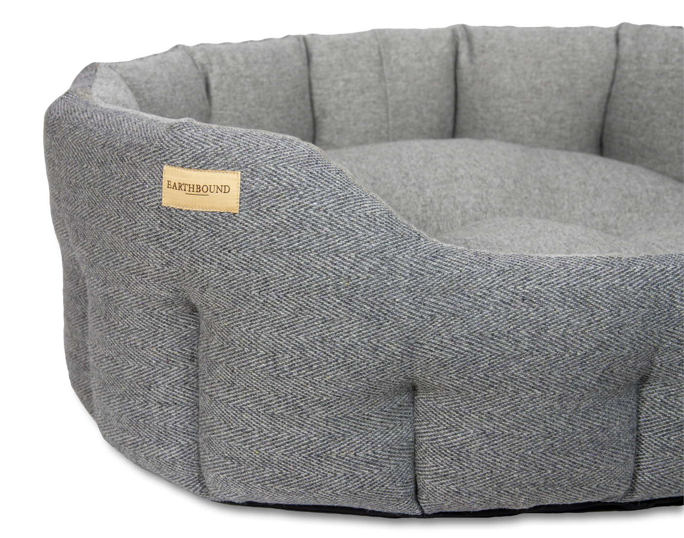 Close up of traditional tweed steel grey classic dog bed