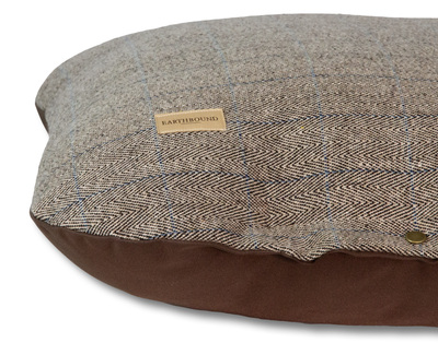 Close up of tweed beige flat dog cushion