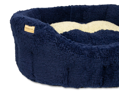 Close up of sherpa bone navy classic dog bed