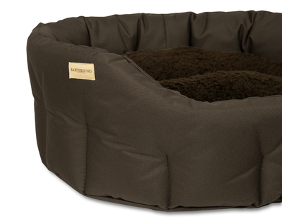Close up of classic round waterproof dog bed in brown
