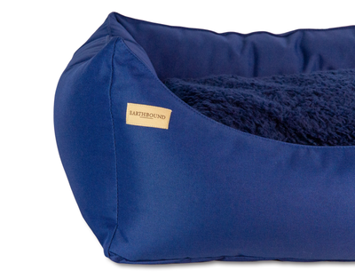 Close up of navy waterproof rectangular removable dog bed